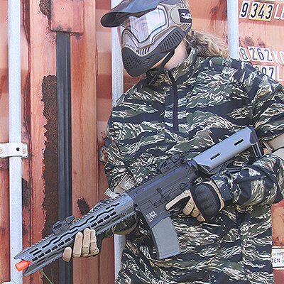 Valken airsoft gear in action with tiger stripe camo, valken gloves, valken goggles and a valken ASL TRG airsoft gun